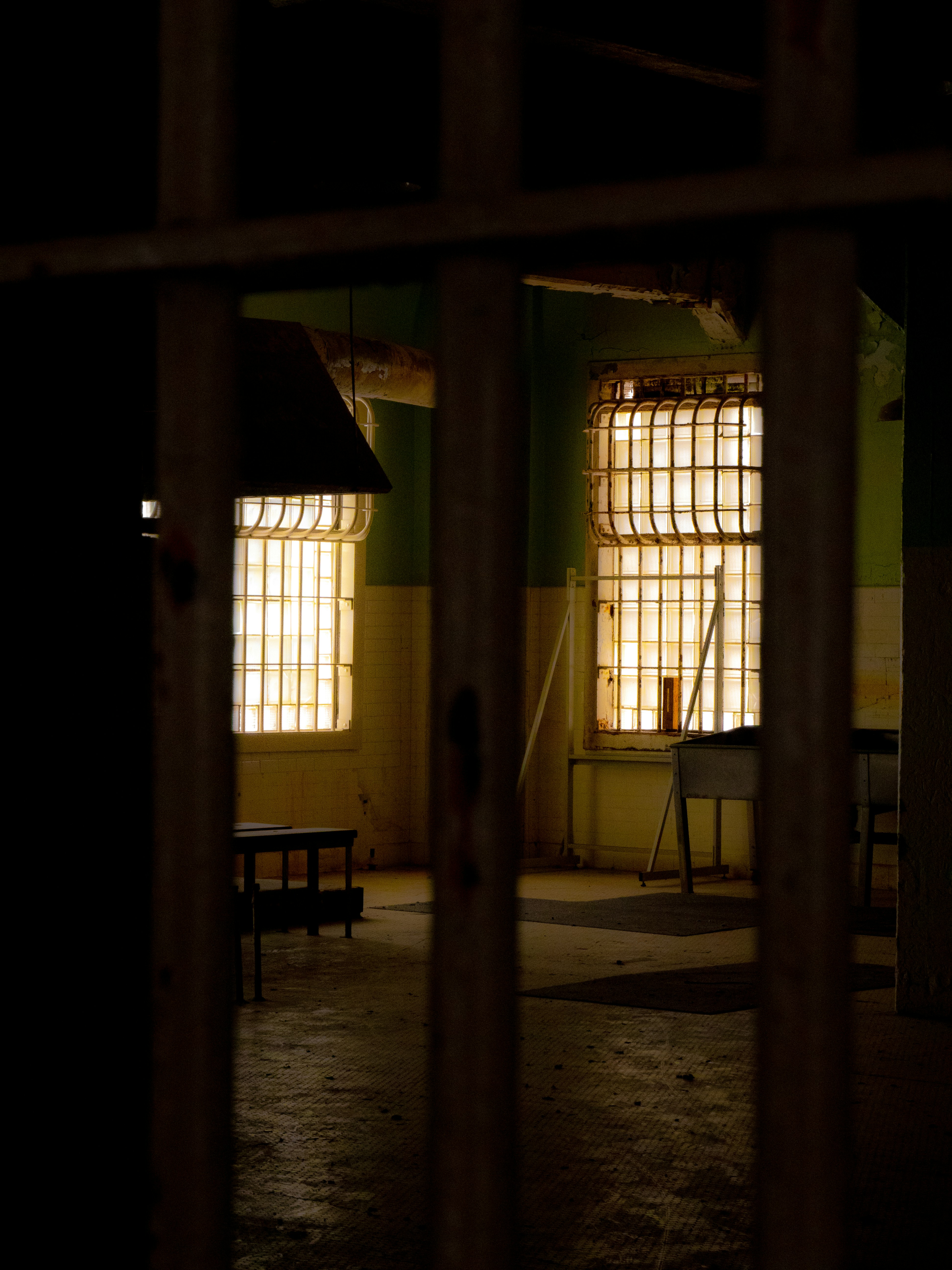 photo of light coming form a window in detention, with bars on the windows