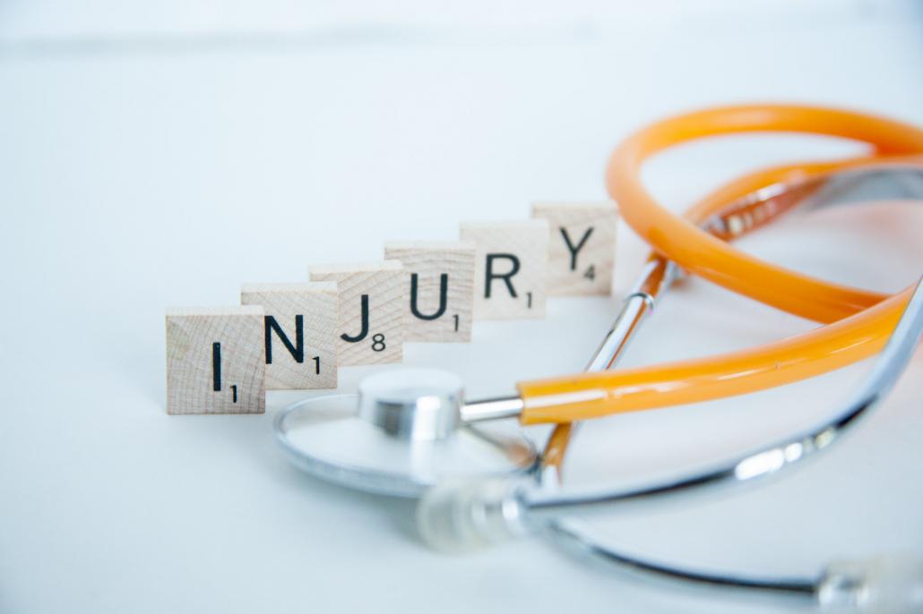 Image of stethoscope next to the word "Injury"