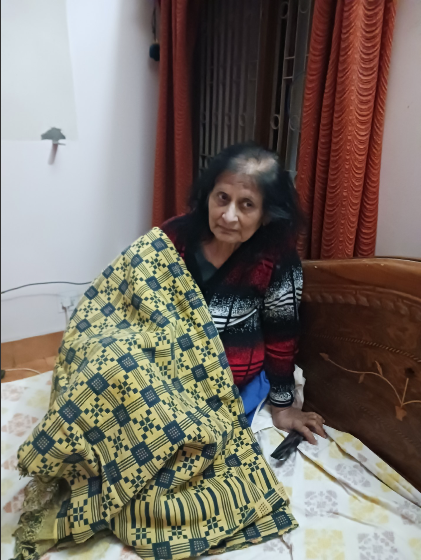 Figure 2: Mrs. Aneeta Khetrapal, mother of the first author, shares her khes (textile artwork) story. This khes was woven by her mother and was brought to India as a part of limited belongings that her parents could carry during the Partition. (Source: First Author’s personal picture. Prayagraj, India). 