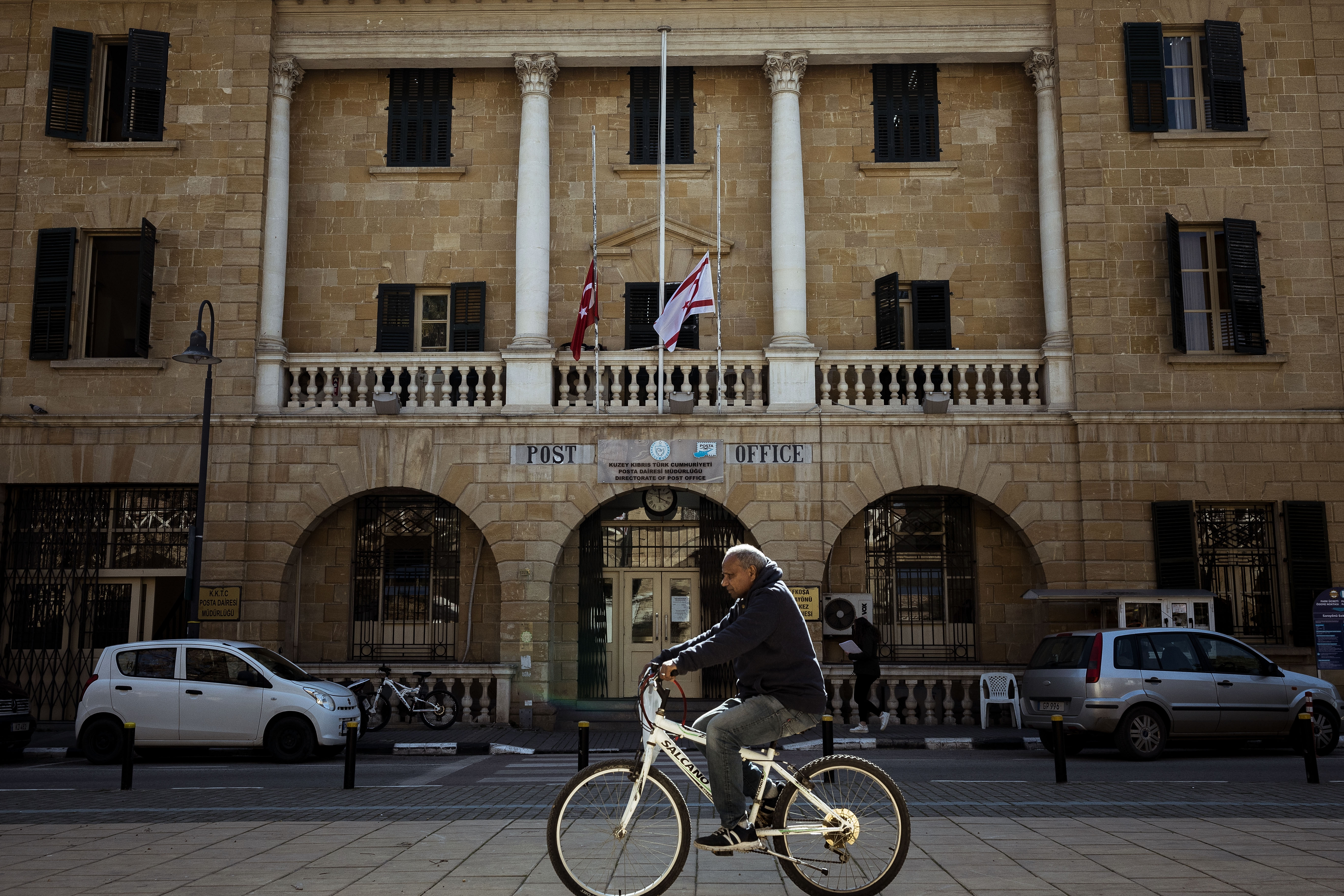 picture of someone cycling down a street in cyprus