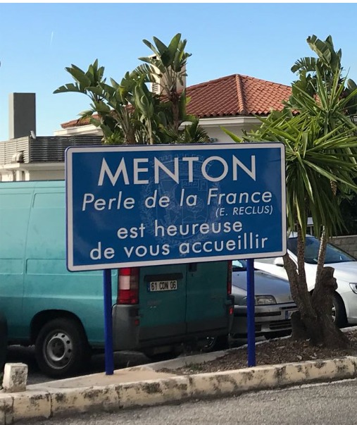 Sign saying Menton, pearl of France, is glad to welcome you