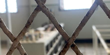 photo of a room seen though a fence 