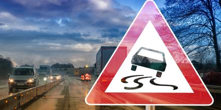 Highway sign warning about vehicle slippage.