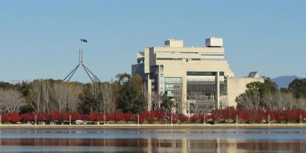 The High Court of Australia photographed from a distance by water.