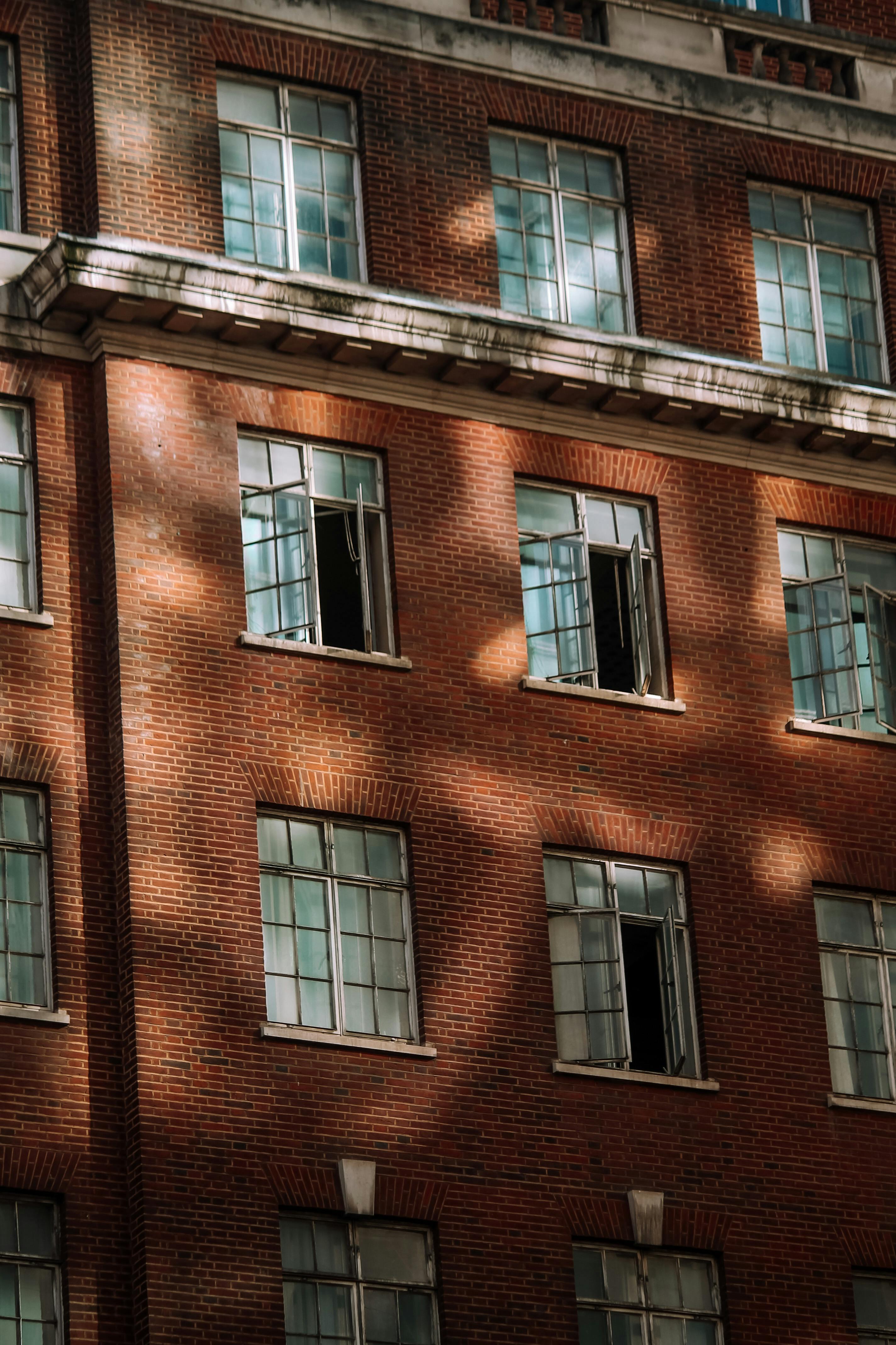 Red brick building block with rows of windows