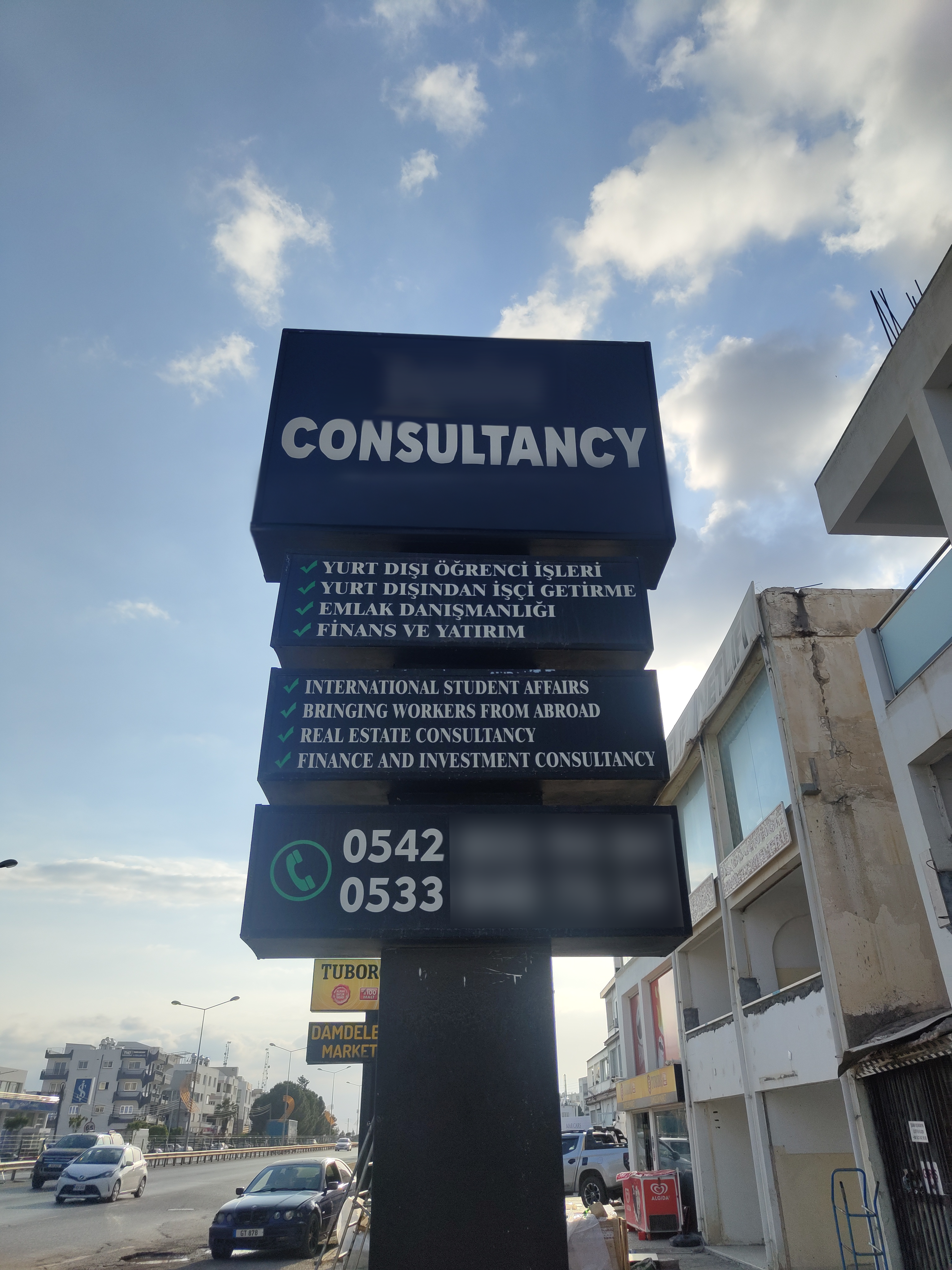 Billboard advertising recruitment of international students and workers, real estate and investment services in the TRNC 