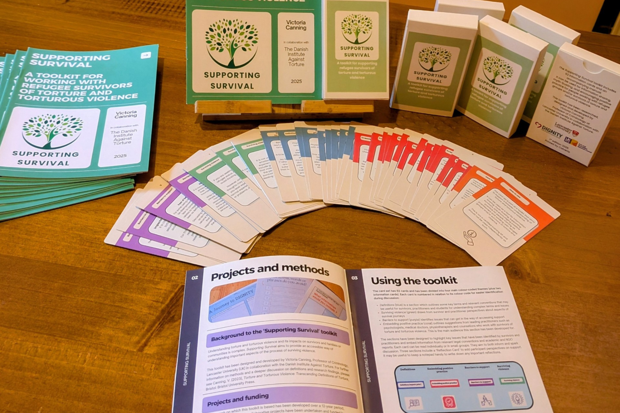 Supporting survival cards and leaflet laid out on a table